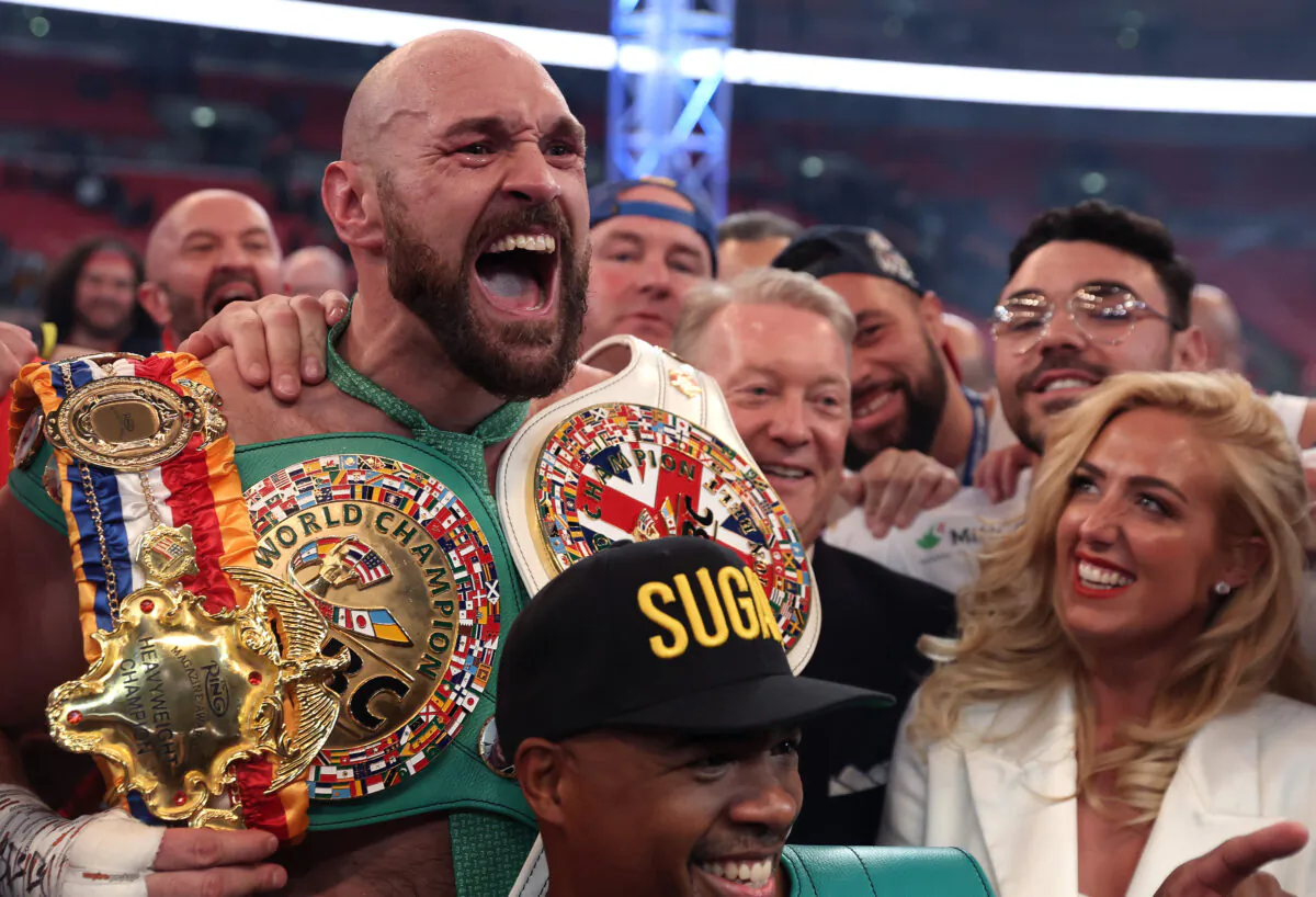 Tyson Fury celebrates victory after the WBC World Heavyweight Title Fight between Tyson Fury and Dillian Whyte at Wembley Stadium in London on April 23, 2022. (Julian Finney/Getty Images)