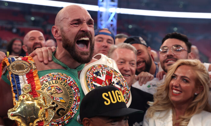 Tyson Fury celebrates victory after the WBC World Heavyweight Title Fight between Tyson Fury and Dillian Whyte at Wembley Stadium in London on April 23, 2022. (Julian Finney/Getty Images)