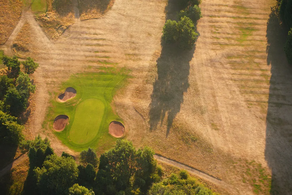 A splash of green amid the dried out fairways of Ashton Court Golf Course, near Bristol, on Aug. 12, 2022. (Ben Birchall/PA)