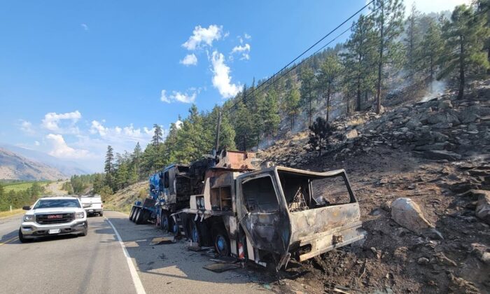 A burned out vehicle is shown after an accident that sparked a wildfire on Highway 3 west of Osoyoos near Richter Mountain in this recent handout photo. (The Canadian Press/HO - Okanagan-Similkameen Regional District)