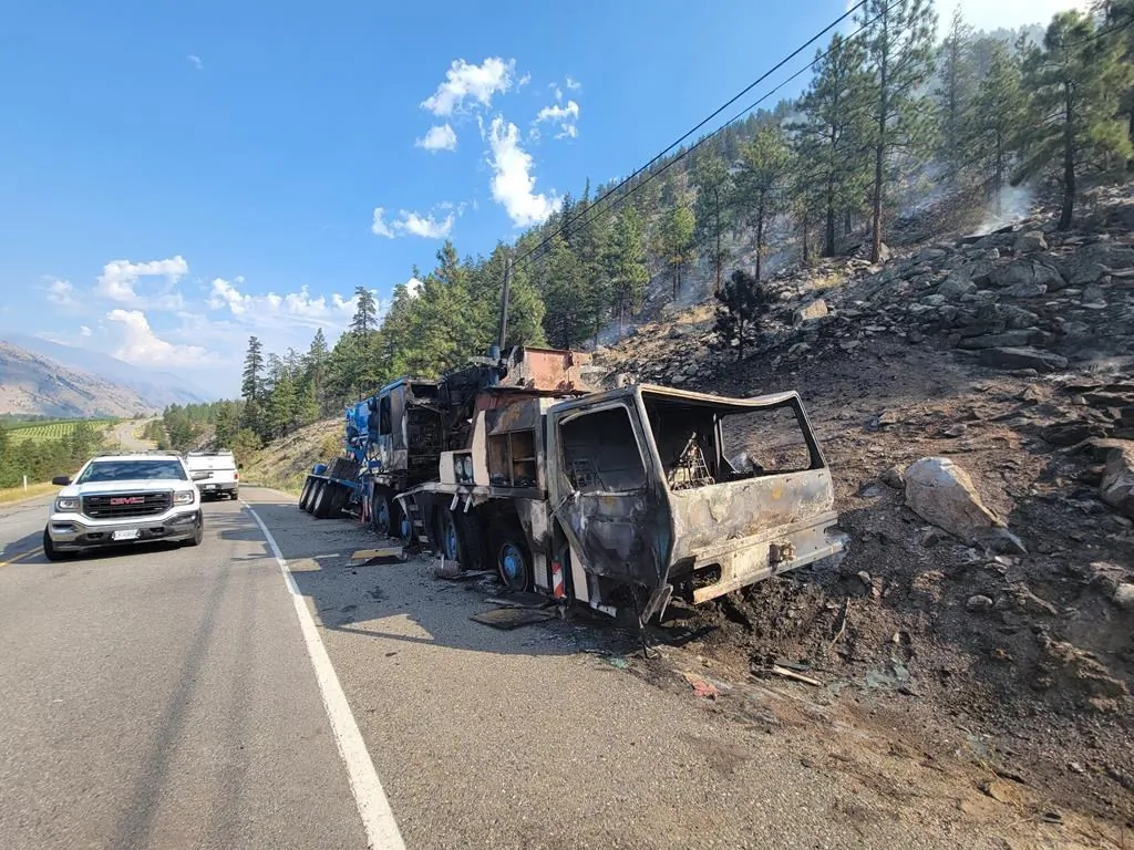 A burned out vehicle is shown after an accident that sparked a wildfire on Highway 3 west of Osoyoos near Richter Mountain in this recent handout photo. (The Canadian Press/HO - Okanagan-Similkameen Regional District)