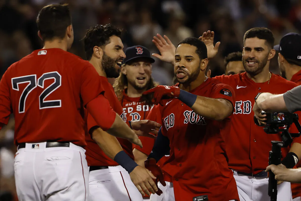 Tommy Pham #22 of the Boston Red Sox celebrates with teammates after his game winning hit against the New York Yankees during the 10th inning at Fenway Park in Boston, Mass., on August 12, 2022. (Winslow Townson/Getty Images)