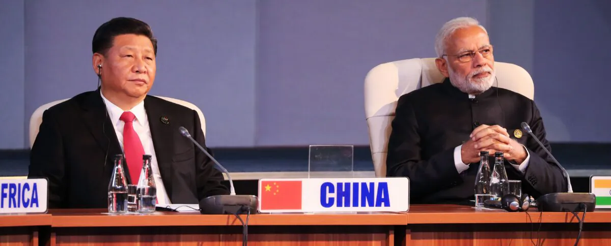 Chinese leader Xi Jinping and Indian Prime Minister Narendra Modi attend a session meeting during the 10th BRICS summit (acronym for the grouping of the world's leading emerging economies, namely Brazil, Russia, India, China and South Africa) in Johannesburg, South Africa, on July 27, 2018. (Mike Hutchings/AFP via Getty Images)