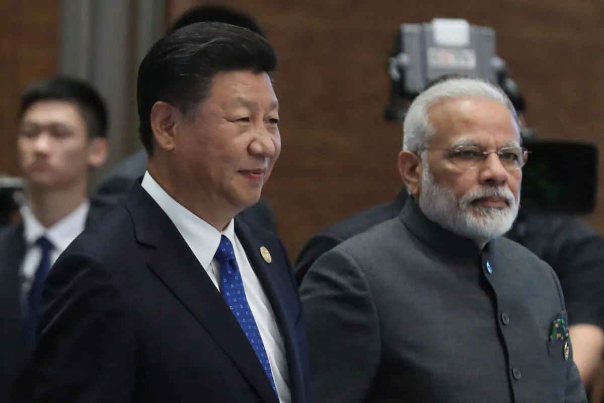 Chinese leader Xi Jinping (L) and Indian Prime Minister Narendra Modi attend the Dialogue of Emerging Market and Developing Countries on the sidelines of the 2017 BRICS Summit in Xiamen, southeastern China's Fujian Province on Sept. 5, 2017. (Wu Hong/AFP via Getty Images)