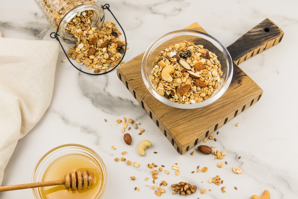 Homemade,Granola,With,Honey,In,A,Glass,Bowl,On,A
