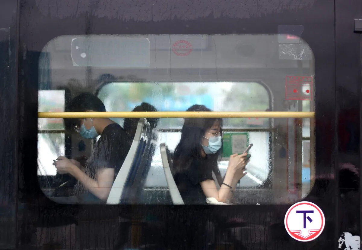 Commuters on a bus in Shenzhen in southern China’s Guangdong Province on May 22, 2020. (Noel Celis/AFP via Getty Images)