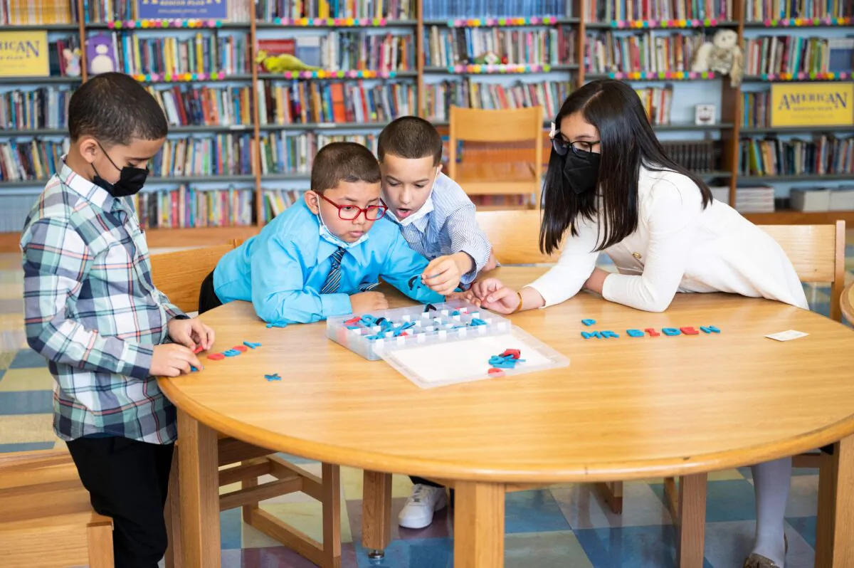 Students play with letters at Luis Munoz Marin Elementary School in Philadelphia, on March 11, 2022. (Jim Watson/AFP via Getty Images)