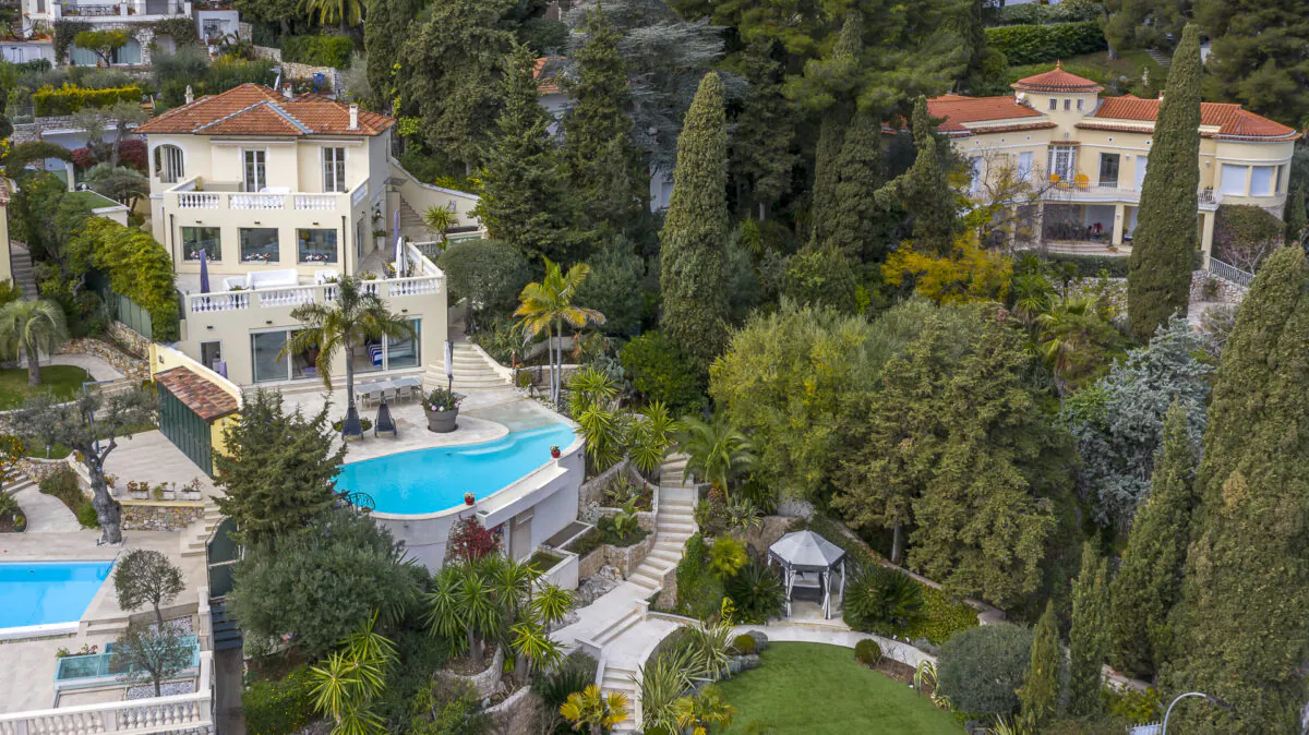 Carved into a skillfully terraced hillside plot, the villa is stunning inside and out. Here, you see the perfectly manicured gardens and terraces, with the infinity pool as the focal point. (The villa owners/Carlton International)