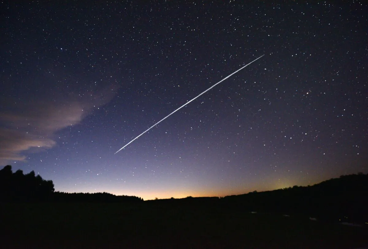 A trail of a group of SpaceX's Starlink satellites passing over Uruguay seen from the countryside some 185 km north of Montevideo near Capilla del Sauce, Florida Department, Uruguay, on Feb. 7, 2021. (Mariana Suarez/AFP via Getty Images)