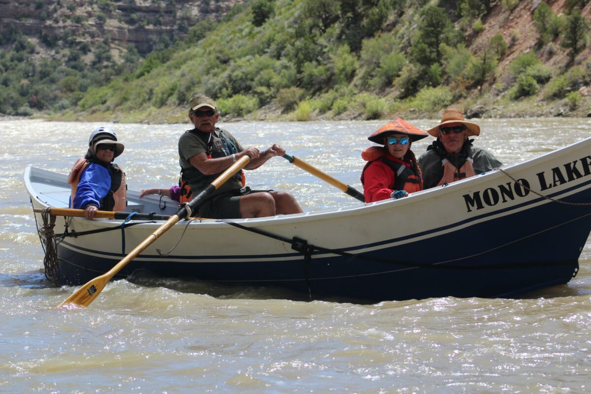 "Doc" Nicholson steering his dory "Mono Lake" on OARS raft trip down Yampa River in 2019. (Andy Yemma)