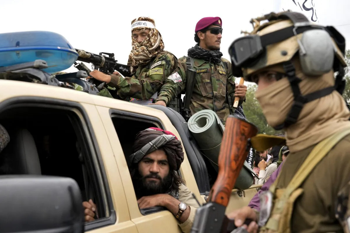 Taliban fighters celebrate one year since they seized the Afghan capital, Kabul, in front of the U.S. Embassy in Kabul, Afghanistan, on Aug. 15, 2022. (Ebrahim Noroozi/AP Photo)