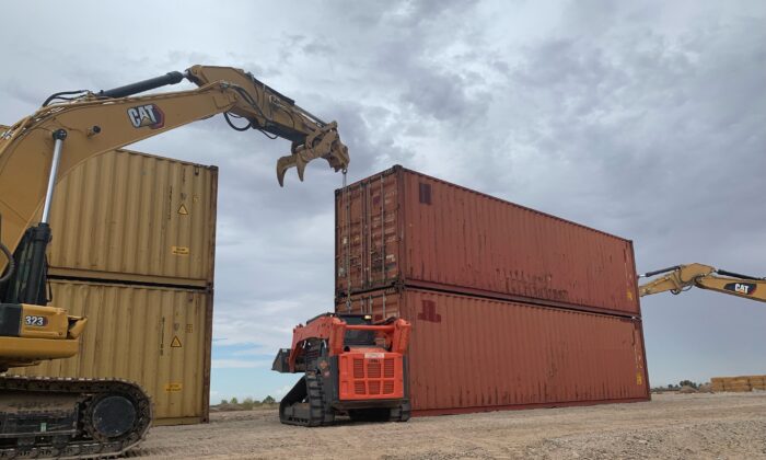 Shipping containers are used to fill a gap in the border wall with Mexico near Yuma, Ariz., on Aug. 12, 2022. (Arizona Governor's Office via AP)