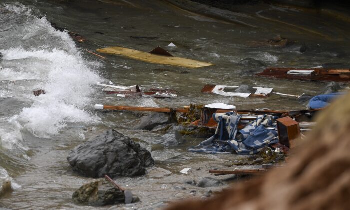 Wreckage and debris washes ashore at Cabrillo National Monument near where a boat capsized just off the coast in San Diego on May 2, 2021. (AP Photo/Denis Poroy, File)