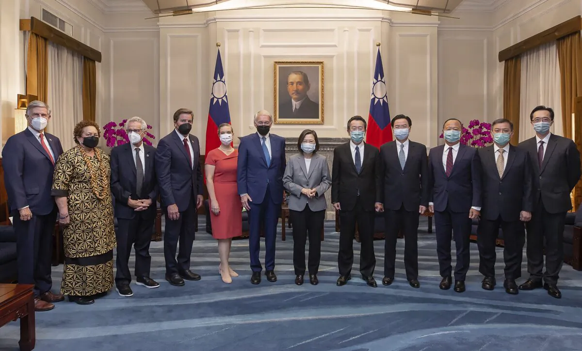 Taiwanese President Tsai Ing-wen (R-6) poses for photos with U.S. congressional delegation and other Taiwan officials during a meeting at the Ppresidential Office in Taipei, Taiwan, on Aug. 15, 2022. (Taiwan Presidential Office via AP)