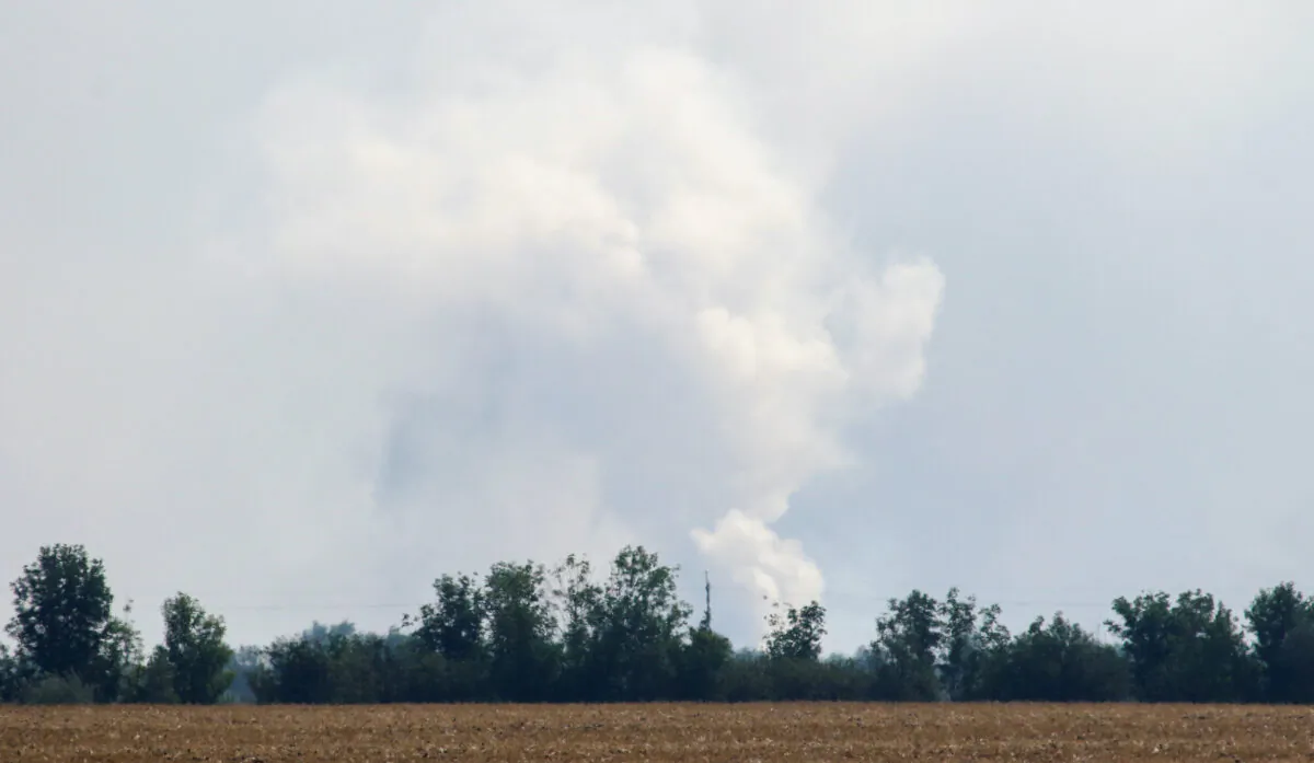 Smoke rising above the area following an alleged explosion in the village of Mayskoye in the Dzhankoi district, Crimea, on Aug. 16, 2022. (Reuters/Stringer)