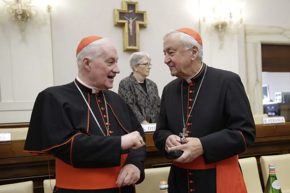 Cardinal Marc Ouellet, left, talks with Cardinal Vincent Nichols, before the start of an event at the Vatican on Oct. 12, 2019. (The Canadian Press/AP, Alessandra Tarantino)