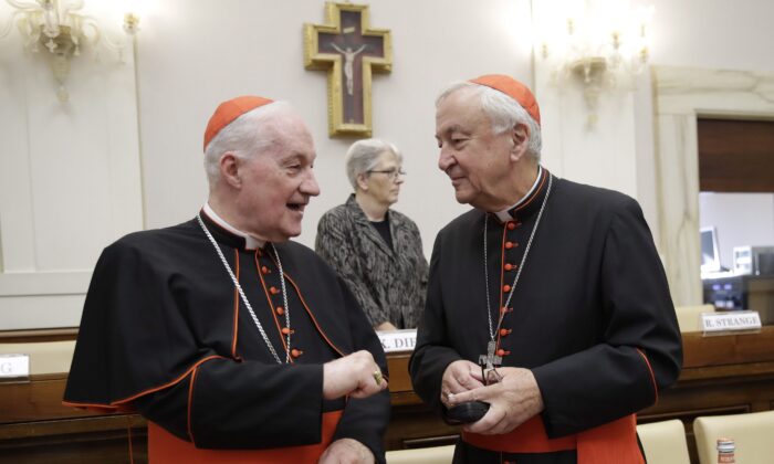 Cardinal Marc Ouellet, left, talks with Cardinal Vincent Nichols, before the start of an event at the Vatican on Oct. 12, 2019. (The Canadian Press/AP, Alessandra Tarantino)