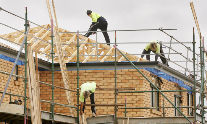 Builders work on a new house in Melbourne, Australia, on Nov. 8, 2006. (William West/AFP via Getty Images)