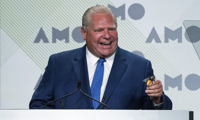 Ontario Premier Doug Ford jokes about swallowing a bee before speaking to the Association of Municipalities Ontario conference, Aug. 15, 2022 in Ottawa. (The Canadian Press/Adrian Wyld)