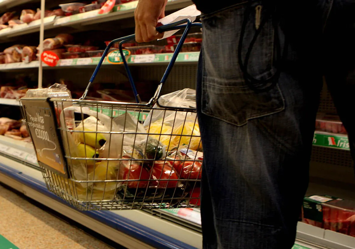 Undated file photo of a man holding a shopping basket in a supermarket. (Julien Behal/PA Media)