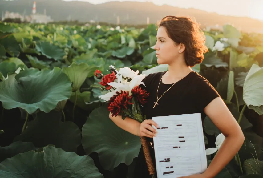Lance Corporal Catherine Arnett holds her court martial papers in Japan in a photo from early August 2022. (Courtesy of Arnett)