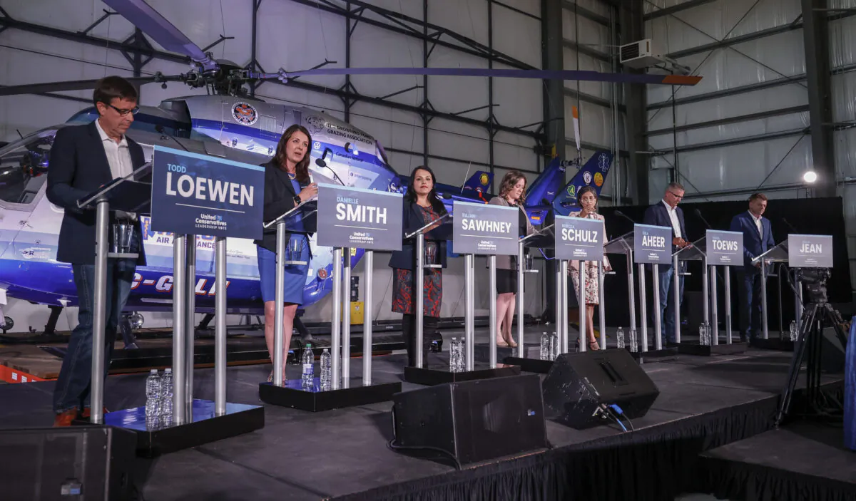 UCP leadership candidates, (L-R) Todd Loewen, Danielle Smith, Rajan Sawhney, Rebecca Schulz, Leela Aheer, Travis Toews, and Brian Jean attend a candidates' debate in Medicine Hat, Alta., on July 27, 2022. (The Canadian Press/Jeff McIntosh)