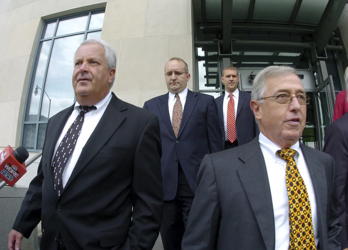 Former Luzerne County Court Judges Michael Conahan (front L) and Mark Ciavarella (front R) leave the United States District Courthouse in Scranton, Pa., on Sept. 15, 2009. (Mark Moran/The Citizens' Voice via AP)