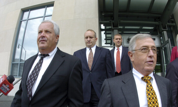 Former Luzerne County Court Judges Michael Conahan (front L) and Mark Ciavarella (front R) leave the United States District Courthouse in Scranton, Pa., on Sept. 15, 2009. (Mark Moran/The Citizens' Voice via AP)