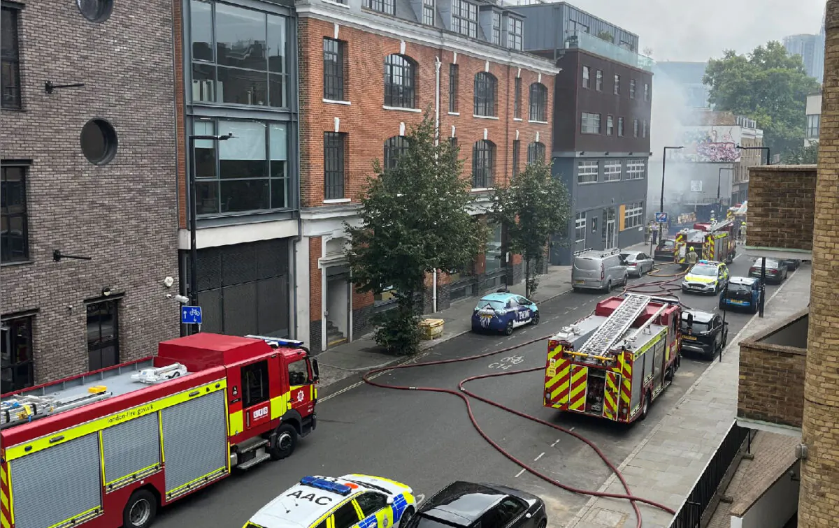 Smoke rises over the Union street after a fire broke out near the London Bridge in London on Aug. 17, 2022. (Twitter/@ChopinLauren/via Reuters)