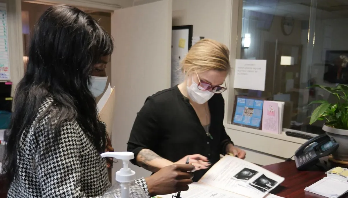 An employee looks over a patient's file at the Hope Medical Group for Women in Shreveport, La., on April 19, 2022. (Francois Picard/AFP via Getty Images)