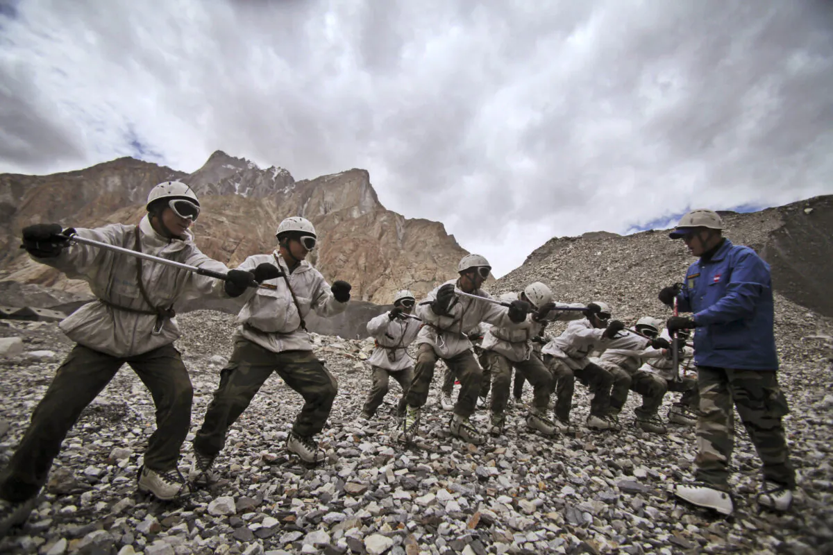 Indian army soldiers undergo a training session at the Siachen base camp in Indian Kashmir on the border with Pakistan on July 19, 2011. (Channi Anand/AP Photo)