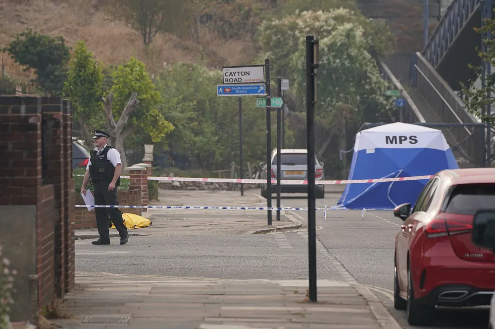 A police tent at the scene where Thomas O'Halloran who had been riding a mobility scooter was stabbed to death, in Greenford, west London, on Aug. 17, 2022. (PA)