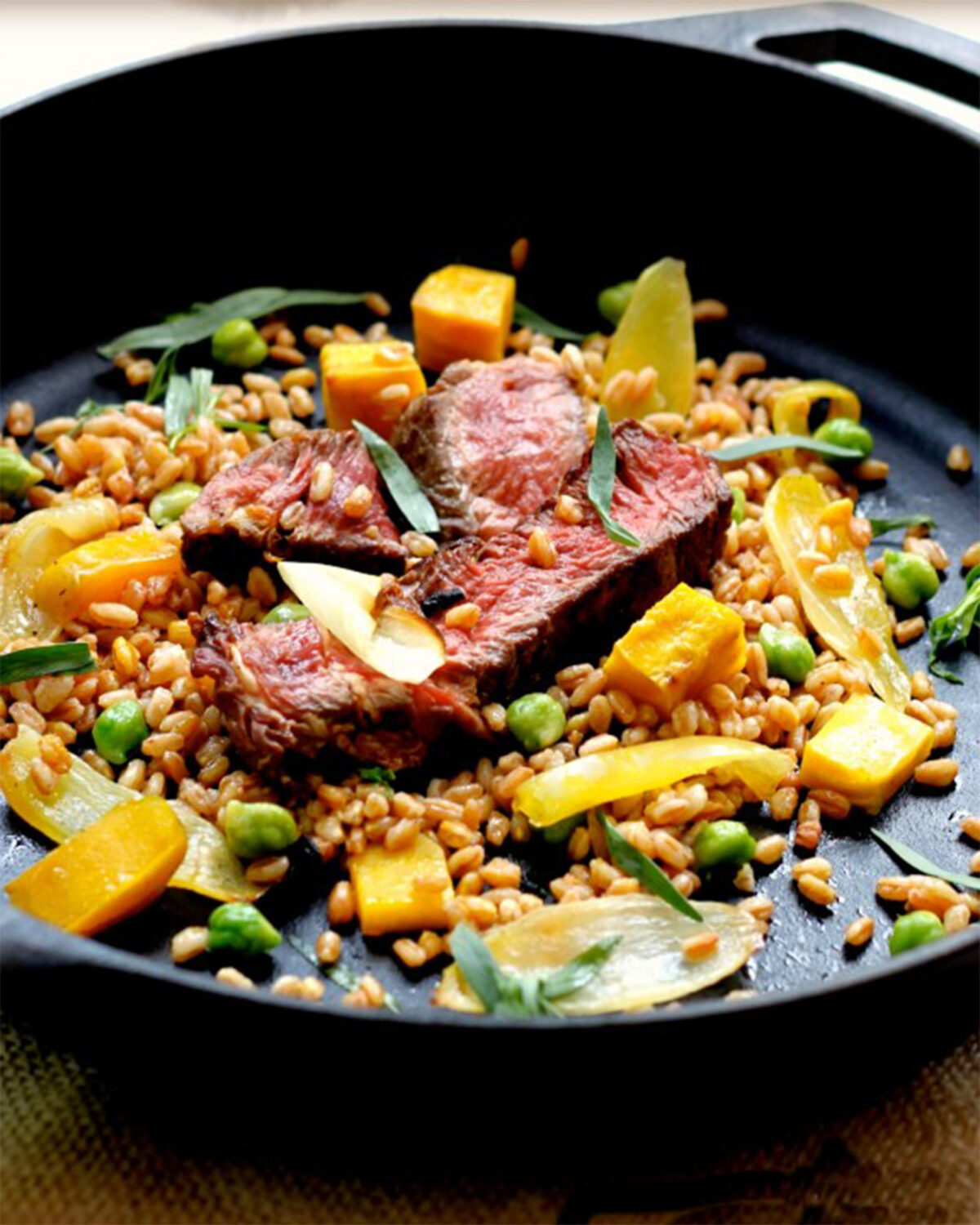 This recipe refreshes leftover steak with a bright lemony vinaigrette, the season's best farmers market produce, and hearty farro to round it out. (Lynda Balslev for Tastefood)