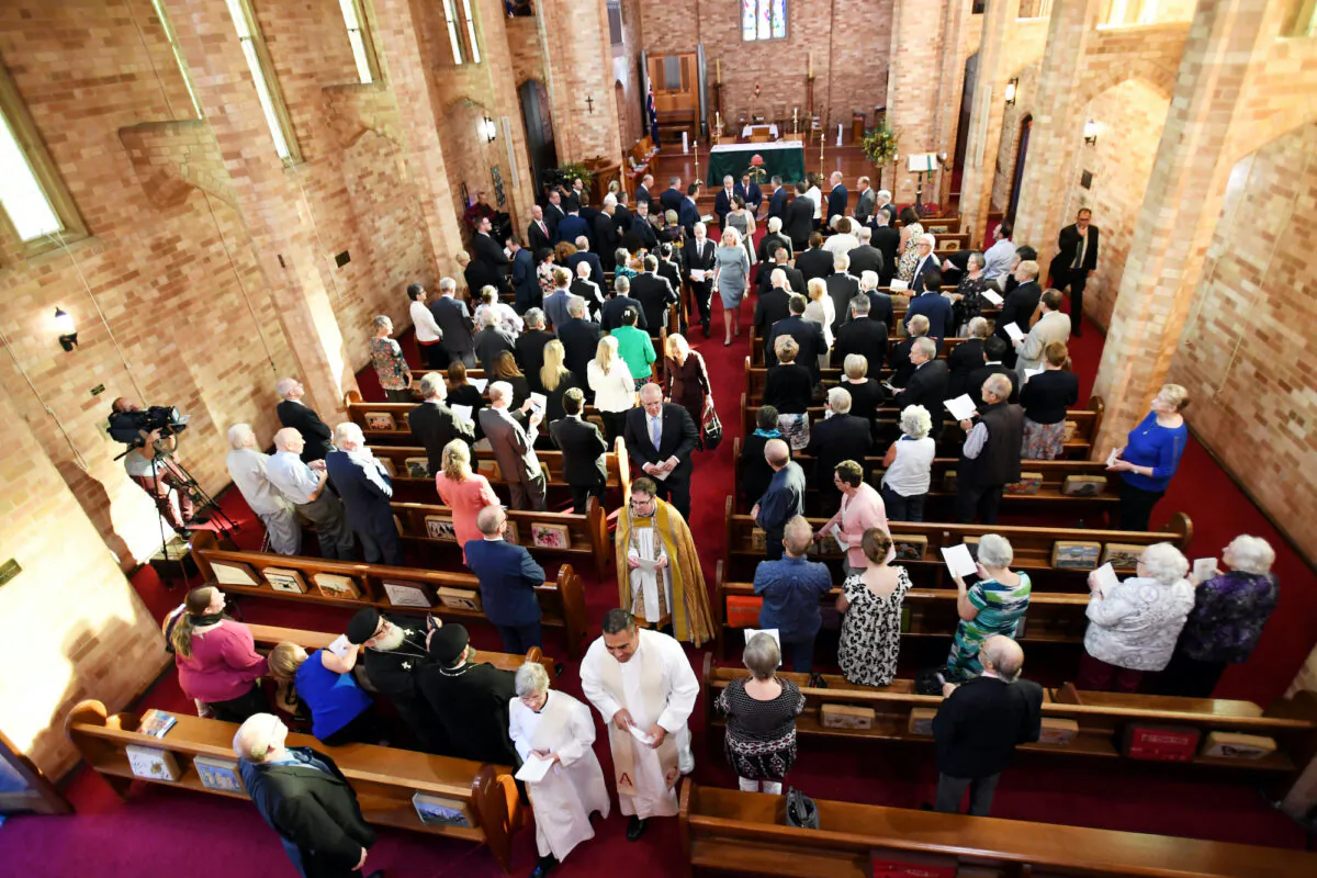 Former Australian Prime Minister Scott Morrison (C) leaves a special ecumenical service to mark the start of the parliamentary year at St Paul’s Anglican church in Canberra, Australia, on Feb. 12, 2019. (Tracey Nearmy/Getty Images)