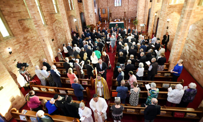 Former Australian Prime Minister Scott Morrison (C) leaves a special ecumenical service to mark the start of the parliamentary year at St Paul’s Anglican church in Canberra, Australia, on Feb. 12, 2019. (Tracey Nearmy/Getty Images)