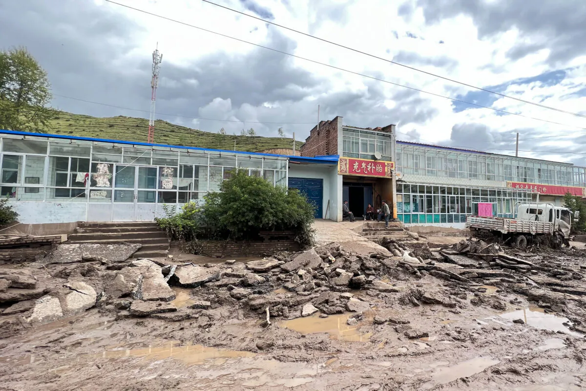 A road is damaged after a flash flooding in Datong county, Xining city, in China's northwestern Qinghai province on Aug. 18, 2022. (CNS/AFP via Getty Images)