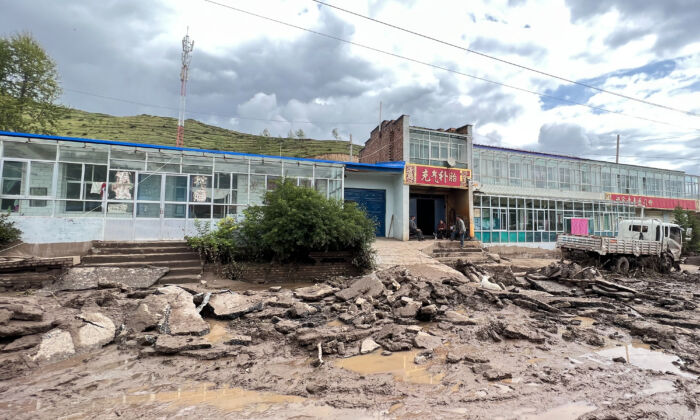 A road is damaged after a flash flooding in Datong county, Xining city, in China's northwestern Qinghai province on Aug. 18, 2022. (CNS/AFP via Getty Images)