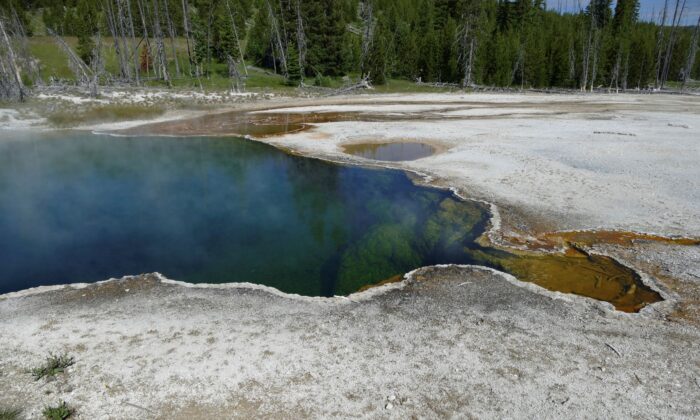 The Abyss Pool hot spring in the southern part of Yellowstone National Park, Wyo., in June 2015. (Diane Renkin/National Park Service via AP)