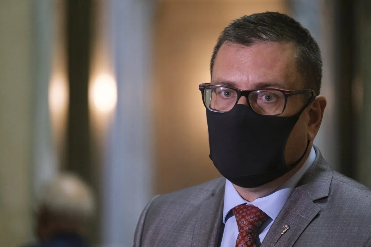 Paul Merriman, minister of health, speaks to media at the Legislative Building in Regina on Oct. 27, 2021. (The Canadian Press/Michael Bell)