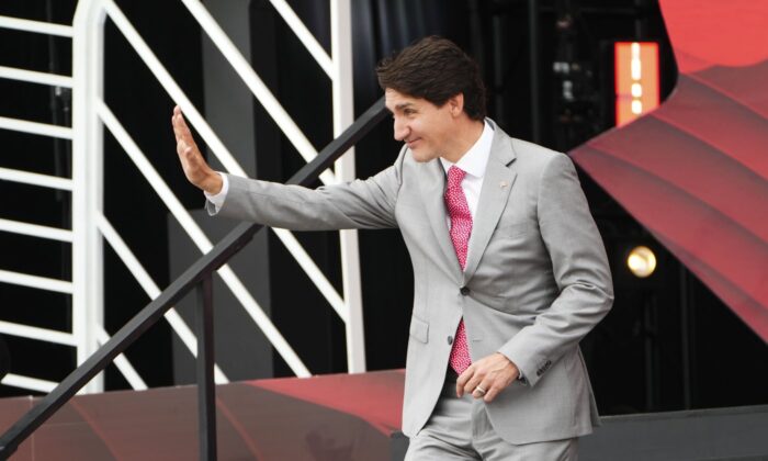 Prime Minister Justin Trudeau waves to the crowd after delivering a speech during Canada Day celebrations at LeBreton Flats in Ottawa on July 1, 2022. (The Canadian Press/Sean Kilpatrick)