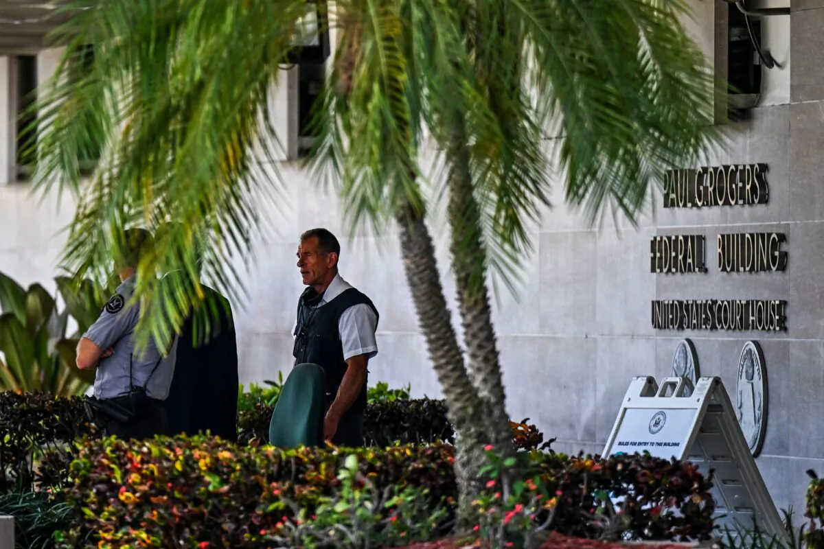 Security officers guard the entrance to the Paul G. Rogers Federal Building & Courthouse as the court holds a hearing to determine if the affidavit used by the FBI as justification for last week's search of Trump's Mar-a-Lago estate should be unsealed, at the US District Courthouse for the Southern District of Florida in West Palm Beach, Fla., on August 18, 2022. (Chandan Khanna/AFP via Getty Images)