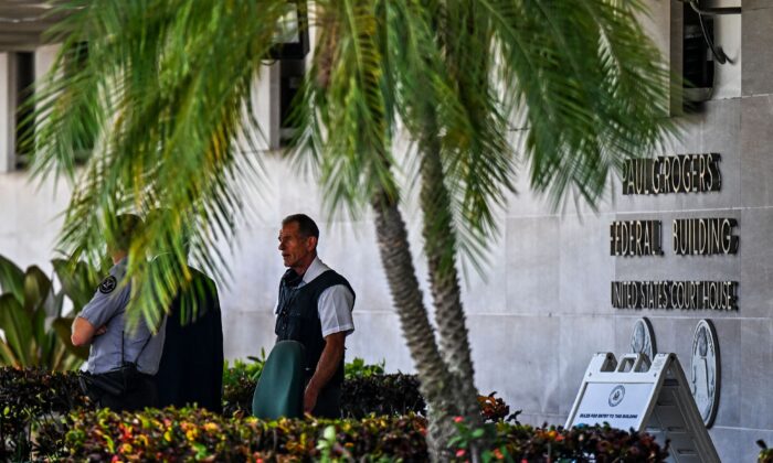 Security officers guard the entrance to the Paul G. Rogers Federal Building & Courthouse as the court holds a hearing to determine if the affidavit used by the FBI as justification for last week's search of Trump's Mar-a-Lago estate should be unsealed, at the US District Courthouse for the Southern District of Florida in West Palm Beach, Fla., on August 18, 2022. (Chandan Khanna/AFP via Getty Images)