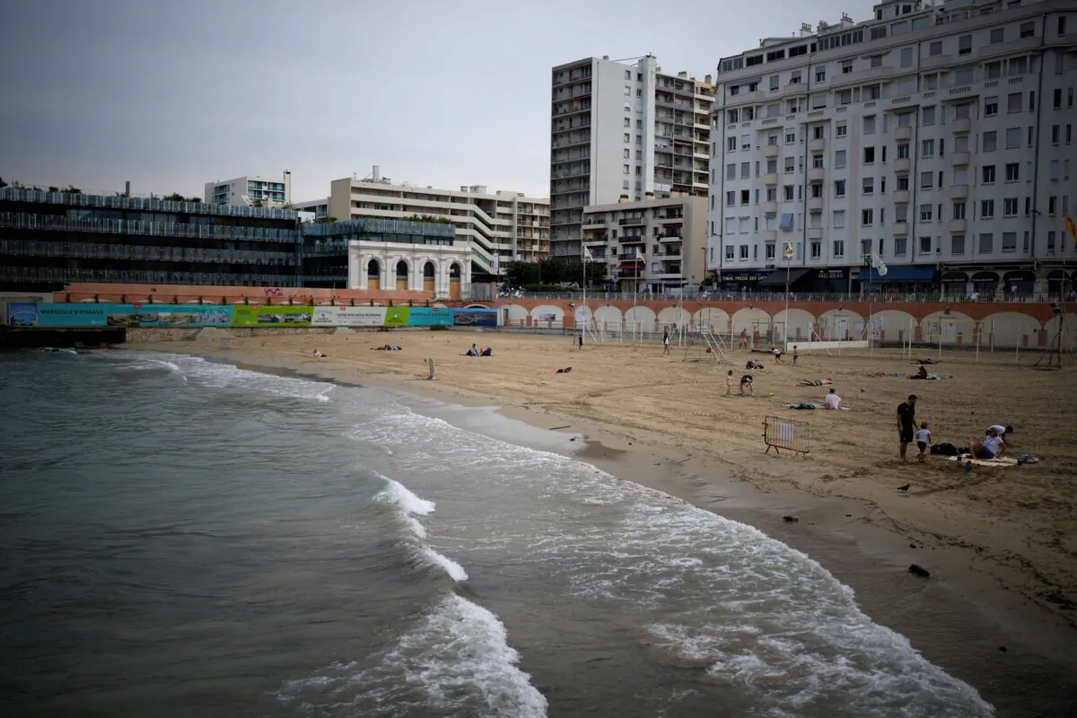 A closed off beach with high levels of pollution is pictured the morning after a storm passed through Marseille, southern France, on Aug. 18, 2022. (Daniel Cole/AP Photo)