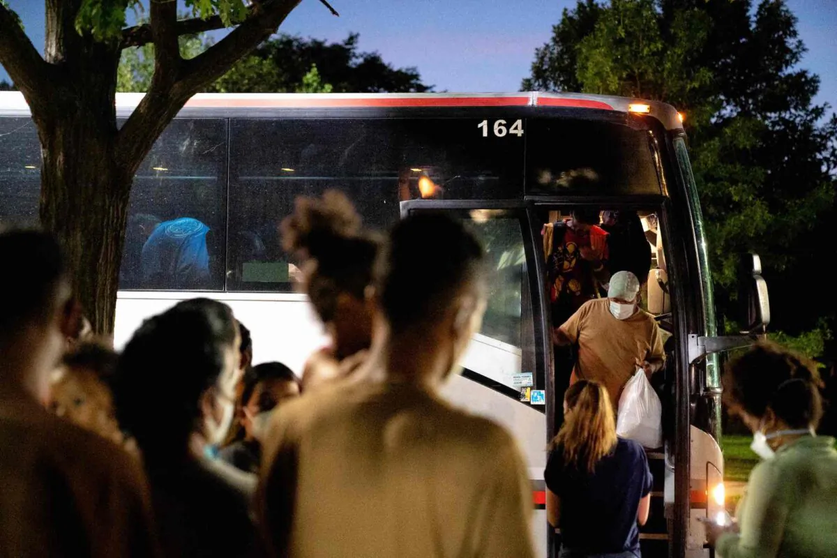 Migrants from Venezuela, who boarded a bus in Del Rio, Texas, disembark within view of the US Capitol in Washington on Aug. 2, 2022. (Stefani Reynolds/AFP via Getty Images)
