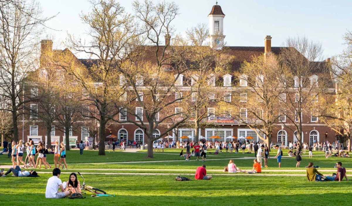 Students walk and sit outside on Quad lawn of University of Illinois college campus in Urbana Champaign, Ill., on April 17, 2016. (Leigh Trail/Shutterstock)