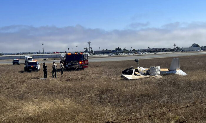 Multiple agencies respond to Watsonville Municipal Airport, northwest of Watsonville, in Santa Cruz County, Calif., on Aug. 18, 2022, after two planes attempting to land collided. (KION-TV via AP)