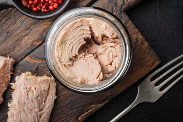 Canned,Tuna,Fillet,Meat,In,Olive,Oil,,On,Black,Background,
