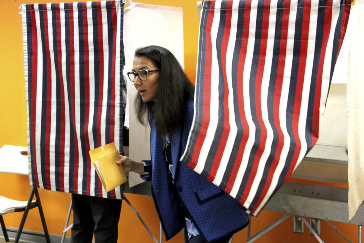 Mary Peltola leaves a voting booth while early voting, in Anchorage, Alaska, on Aug. 12, 2022. (Mark Thiessen, File/AP Photo)