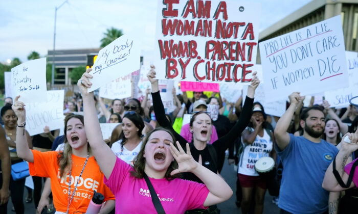 Protesters shout as they join thousands marching around the Arizona Capitol after the Supreme Court decision to overturn the landmark Roe v. Wade abortion decision on June 24, 2022, in Phoenix. (Ross Franklin/AP Photo)