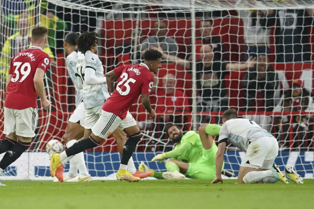 Manchester United's Jadon Sancho celebrates after scoring his side's first goal during the English Premier League soccer match between Manchester United and Liverpool at Old Trafford stadium, in Manchester, England, Aug 22, 2022. (Dave Thompson/AP Photo)